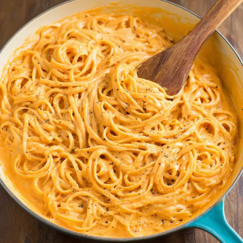 Creamy Red Pepper Alfredo Pasta served on the table