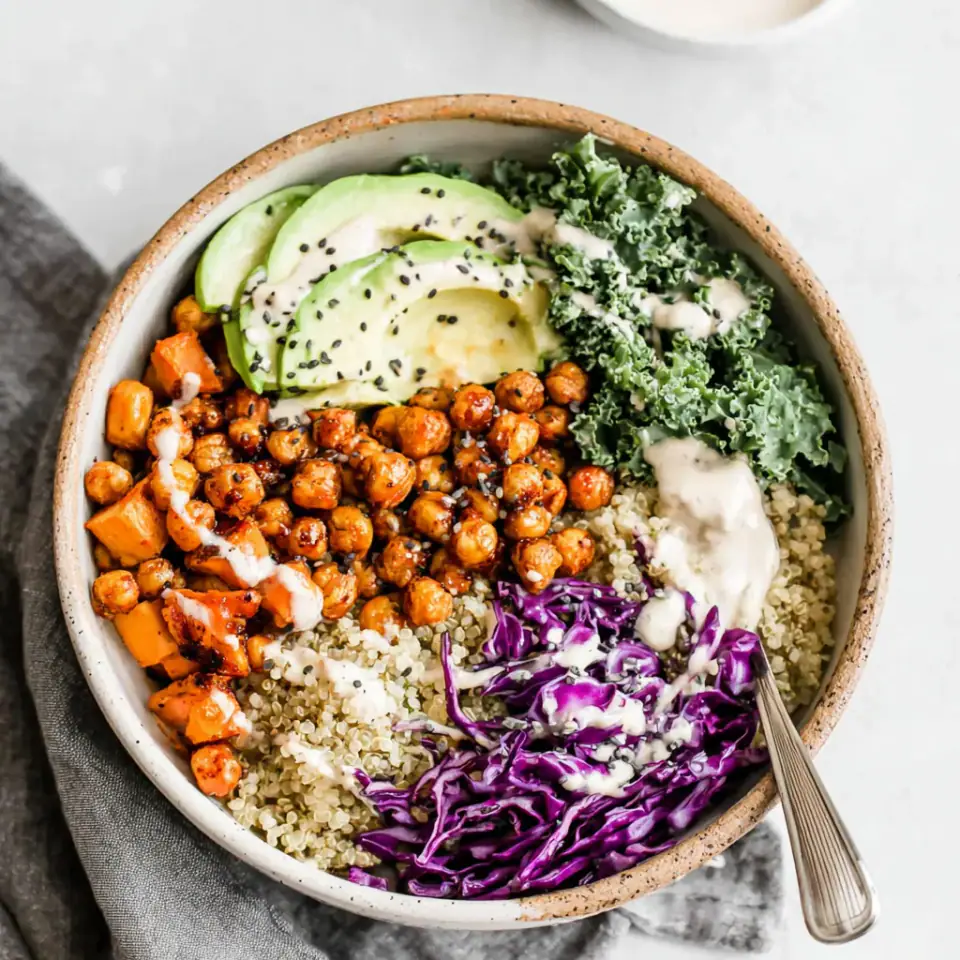 Nourishing Buddha Bowl with Maple Roasted Chickpeas served on the table